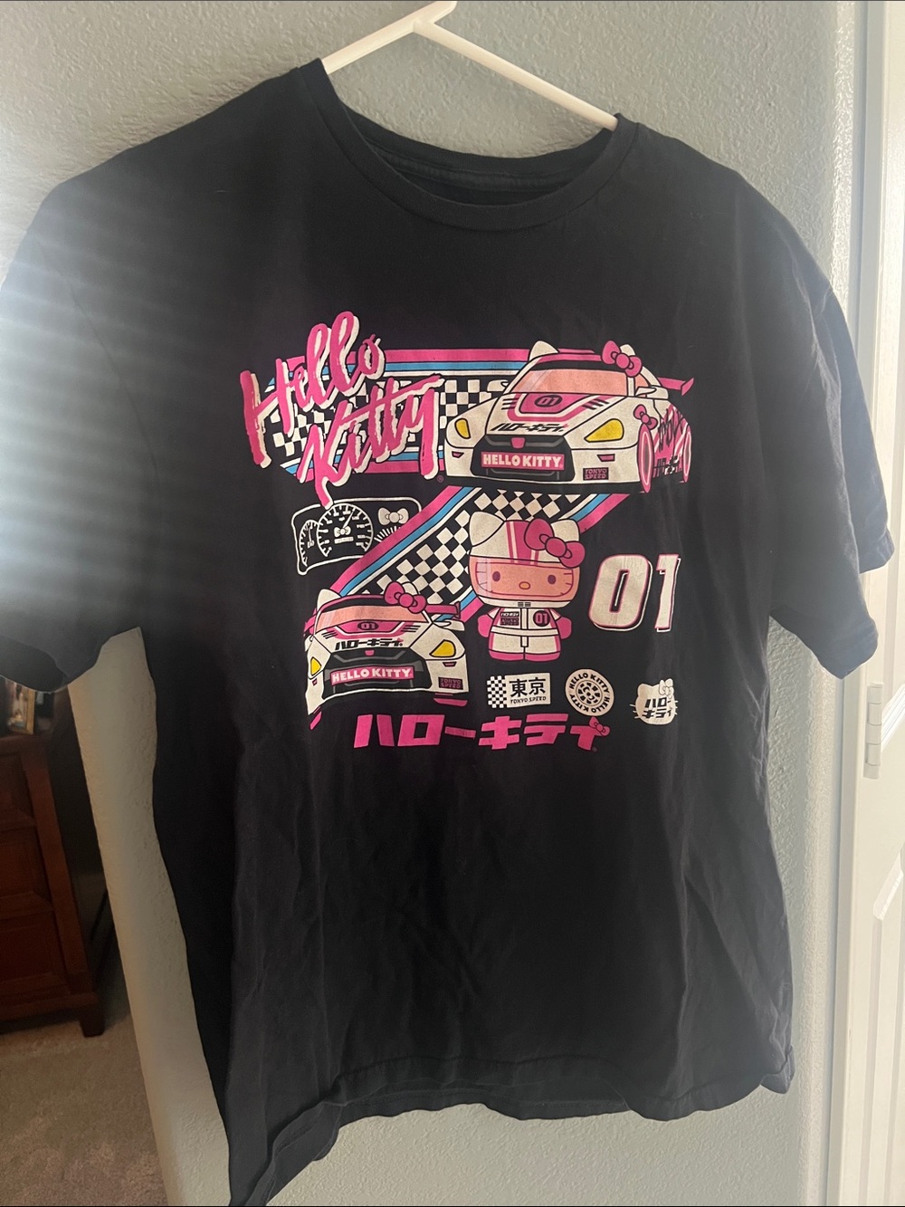 Hello Kitty Black Tee with Pink Racing Graphic and Cyan Accents